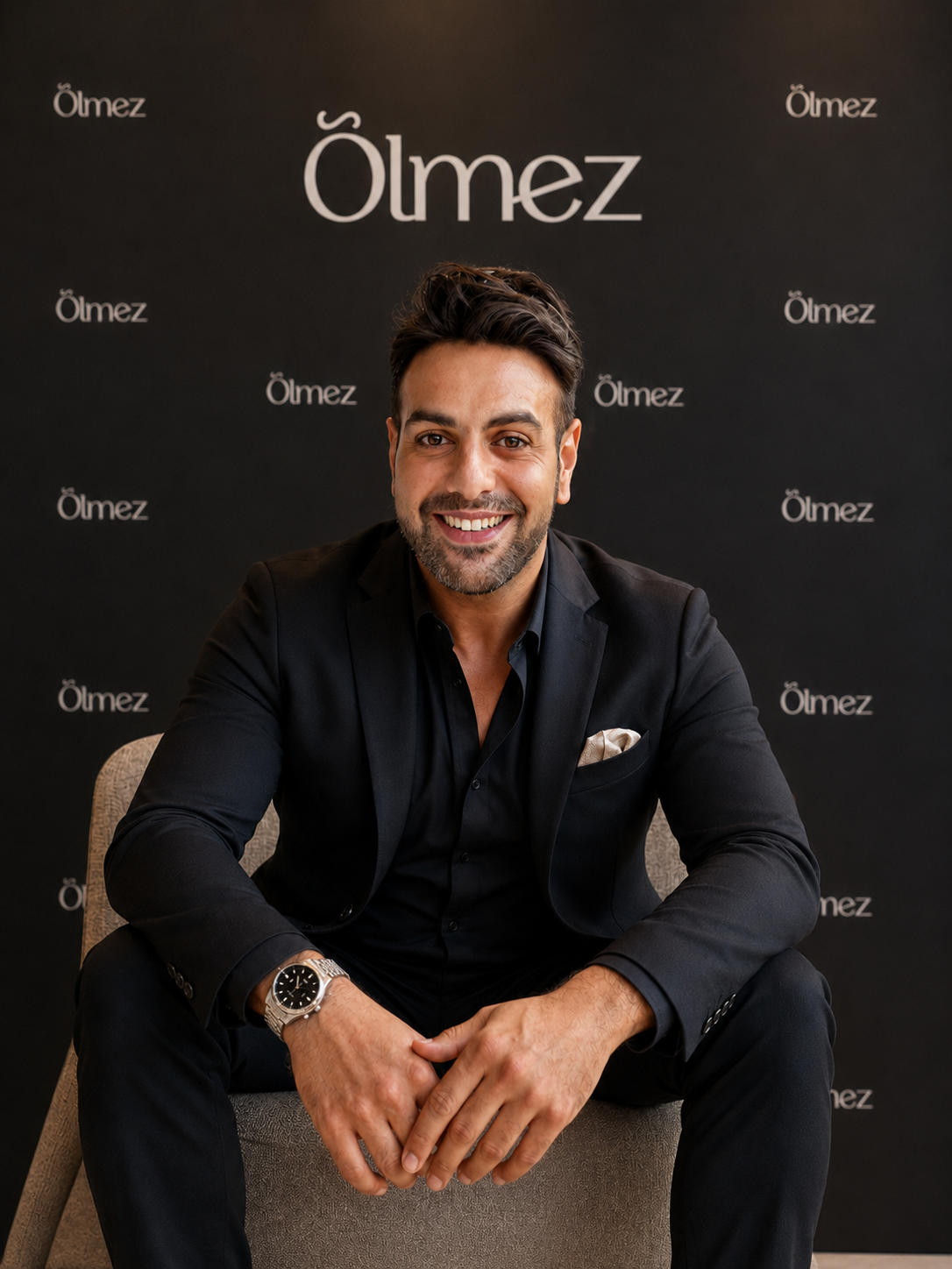 Founder portrait against an Ölmez backdrop